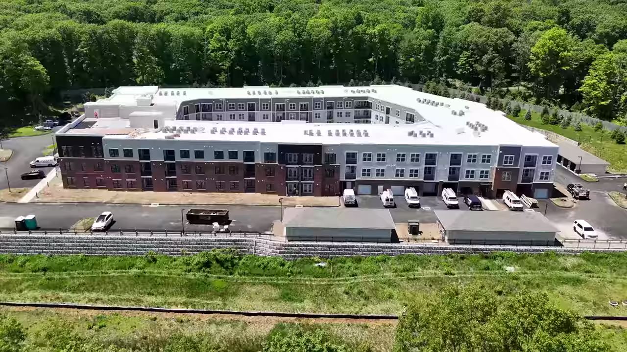 Aerial view of a large multi-building residential complex plumbed and heated by Lorenzo in Connecticut